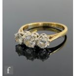 An 18ct diamond three stone ring, brilliant cut claw set stones, total weight of stones