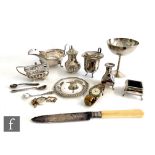 A parcel lot of assorted hallmarked silver items to include a goblet, condiments, a sauce boat, a