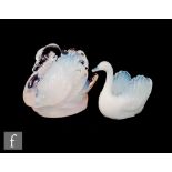 An early 20th Century pressed glass figure of a swan with deep internal opalescent finish, unmarked,