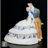 In the manner of Limoges - A 1930s Art Deco model of an embracing lady and gentleman in Victorian