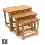 Robert 'Mouseman' Thompson - A nest of three rectangular occasional tables, with typical adzed