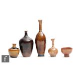 John Andersson - Hoganas - Four miniature vases of varying form decorated in a tonal brown glaze,