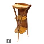Louis Majorelle - A three-tier walnut and marquetry inlaid étagère or what not, detailed with irises