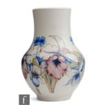 William Moorcroft - A 1930s salt glazed vase of globe and shaft form decorated in the Orchid