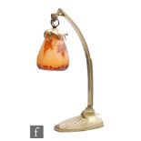 Galle - An early 20th Century Art Nouveau desk lamp, the suspended cameo glass shade cased in