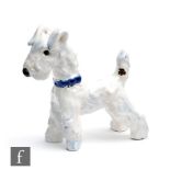 Goldscheider - A small 1930s Art Deco figure of a terrier in standing pose wearing a blue collar,