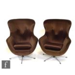 A pair of early 1970s Vono 'egg' style armchairs, upholstered in brown velour or dralon over