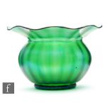 Loetz - A large early 20th Century glass bowl of fluted ovoid form with an everted wide flat rim