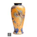Carlton Ware - An Art Deco vase of tapering form decorated in the Bird of Paradise pattern,