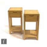 Ercol Furniture - A pair of light oak Bosco range compact side or lamp tables, each fitted with a