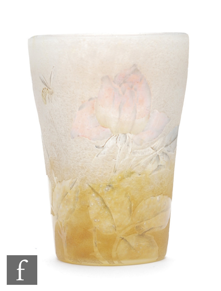 Daum - An early 20th Century cameo glass vase of tumbler form, cased, cut and gilt with roses and