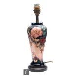 Rachel Bishop - Moorcroft Pottery - An Oberon pattern table lamp, marks obscured by affixed wooden