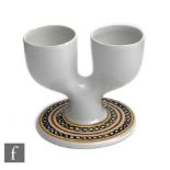 Anne Lewis - Troika Pottery - A double egg cup in white with brown painted decoration to the