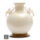 In the manner of Barovier - A Murano incamiciato glass vase of footed ovoid form with collar neck