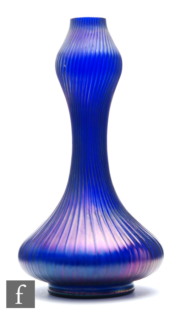 Kralik - An early 20th Century ribbed glass vase of footed low shouldered form with tall swollen