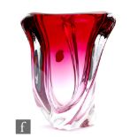 Val St Lambert - A 1960s glass vase of wrythen tri form, in a graduated pink tint cased in clear,