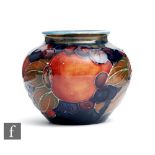 William Moorcroft - A small vase of ovoid from decorated in the Pomegranate pattern with a band of