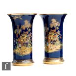 Carlton Ware - A pair of trumpet vases decorated in the New Mikado pattern against a blue ground,