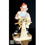 Triart - A 1950s Italian pottery model of a sailor (or pirate) stood before a ships wheel and