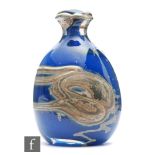 Sam Herman - A glass vase of ovoid form with everted neck with a chloride swirl against the blue