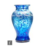 Sarah Cowan - Okra - A later 20th Century studio glass vase of baluster form with an everted rim,