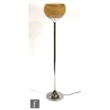 In the manner of Harvey Guzzini - A chromium plated floor lamp with inverted tulip shaped base and