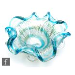 Unknown - A post war Murano glass bowl of circular section with wave rim and pulled decoration,