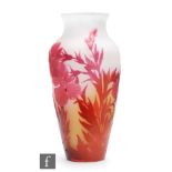 Galle - An early 20th Century French four colour cameo glass vase of baluster form, cased in ruby