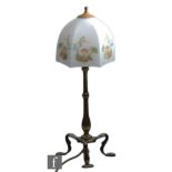 Faraday & Son - An Arts & Crafts brass Pullman table lamp, circa 1910, the three whiplash supports