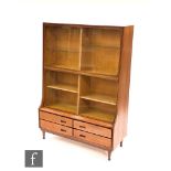Attributed to Meredew Furniture - A teak bookcase display cabinet with two sets of sliding glazed