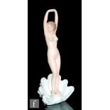 Ronzan - A large Italian pottery model of a stretching standing nude stood in an open clam shell,