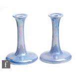 Ruskin Pottery - A pair of lavender lustre candlesticks, impressed mark and dated 1924, height 16.