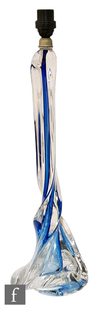 Unknown - A 1970s glass table lamp of wrythen form, the blue core cased in clear, height including