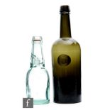 Unknown - A 19th Century Ricketts style glass bottle, circa 1850, in deep green with an applied