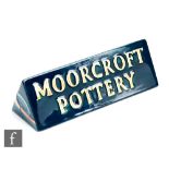 Emma Bossons - Moorcroft Pottery - A triangular name plaque or silent salesman decorated in the