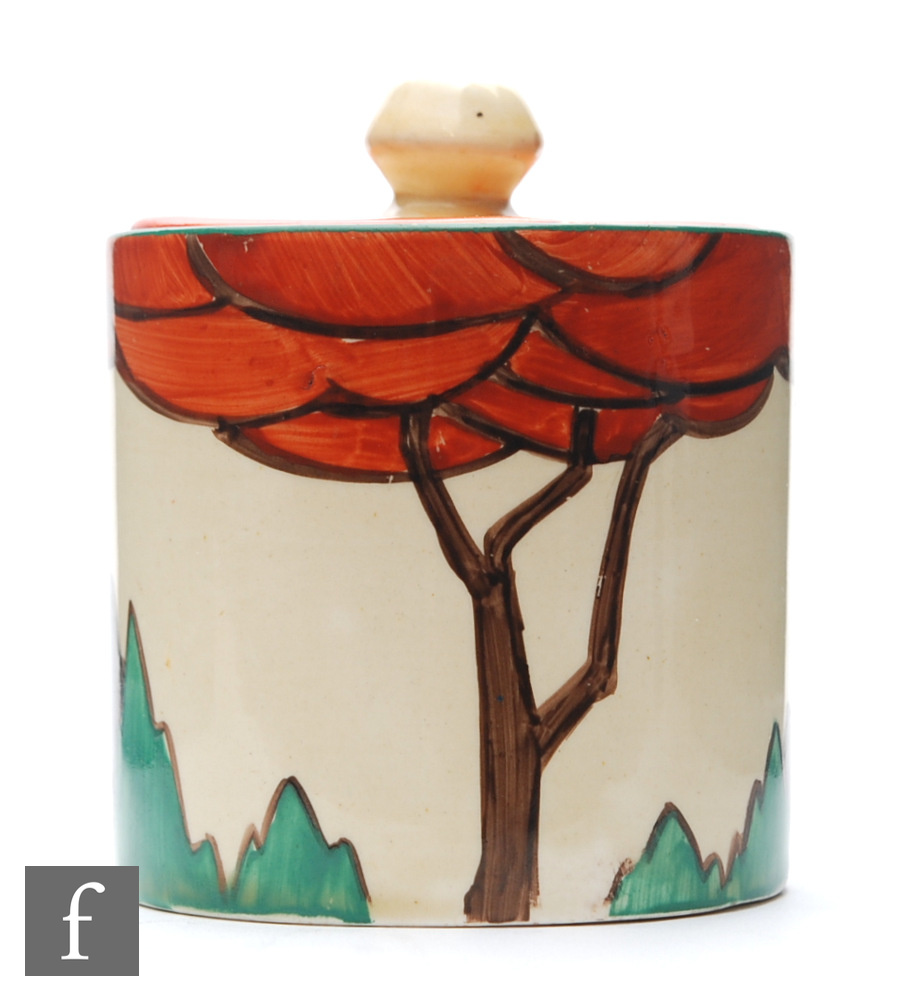 Clarice Cliff - Limberlost - A drum shape preserve pot and cover circa 1932, hand painted with a