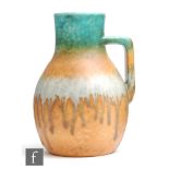 Ruskin Pottery - A crystalline glaze flower jug decorated in a banded green to orange to ice blue to