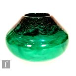 Strathearn - A later 20th Century squat form glass vase, the swirling green glass with aventurine