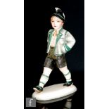 Wolf & Co - An Austrian model of a young boy dressed in his national costume with his hands in his