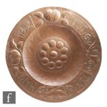 Unknown - An Arts and Crafts copper wall plaque of circular form, with raised circle detailing to