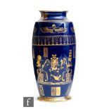 Wiltshaw and Robinson - Carlton Ware - A 1920s vase of barrel form decorated in the Tutankhamun