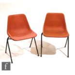 Robin Day - Hille - A set of six orange polypropylene stacking chairs on tubular steel frames,