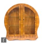 Unknown - A walnut veneered 'scallop shell' style display cabinet, with sunburst style beading to