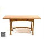 Ercol Furniture - A light elm Kelmscott side table, the top of rounded rectangular form with a