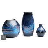 Anita Harris - Poole Pottery - A group of three Living Glaze 'Celestial' pattern vases, heights