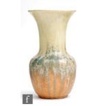Ruskin Pottery - A crystalline glaze vase of mallet form decorated with a yellow to orange glaze