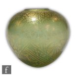 Isle of Wight - A later 20th Century glass vase of squat form decorated with a gold leaf floral