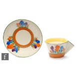 Clarice Cliff - Crocus - A Conical shape tea cup and saucer circa 1933, hand painted with floral