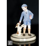 Unknown - A 1950s Italian art pottery model of a young school boy in his uniform holding a stack