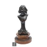 Unknown, probably French - A cast spelter bust figure of a young girl in bronzed finish,